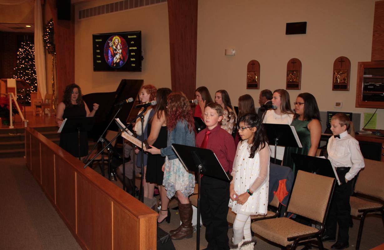 The children’s choir performs before the children’s Mass on Christmas Eve at Holy Cross Church in Kernersville. (John Bunyea | Catholic News Herald)