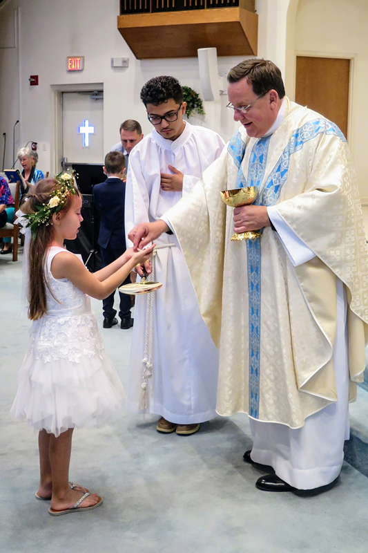 STATESVILLE — On May 6, 52 children received their first Holy Communion at St. Philip the Apostle Church: 16 at the 10:30 a.m. English-language Mass and 36 at the 12:30 p.m. Spanish-language Mass. Father Thomas Kessler, pastor, celebrated both liturgies.