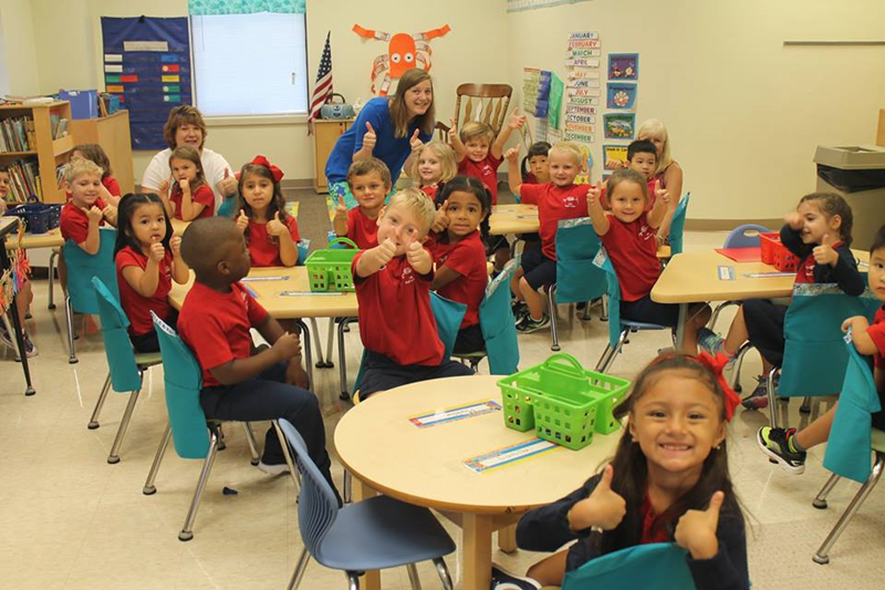 Students at Immaculate Heart of Mary School in High Point give a big thumbs-up on their first day back to class. (Photos courtesy of Paola Scilinguo, Our Lady of Grace School and Immaculate Heart of Mary School Facebook page)