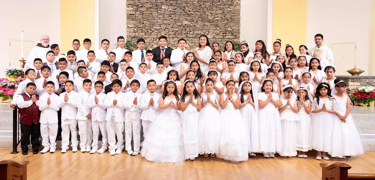 Children at Immaculate Conception Church in Hendersonville received their first Holy Communion during two recent Masses, one said in English and the other in Spanish. (Photos provided)