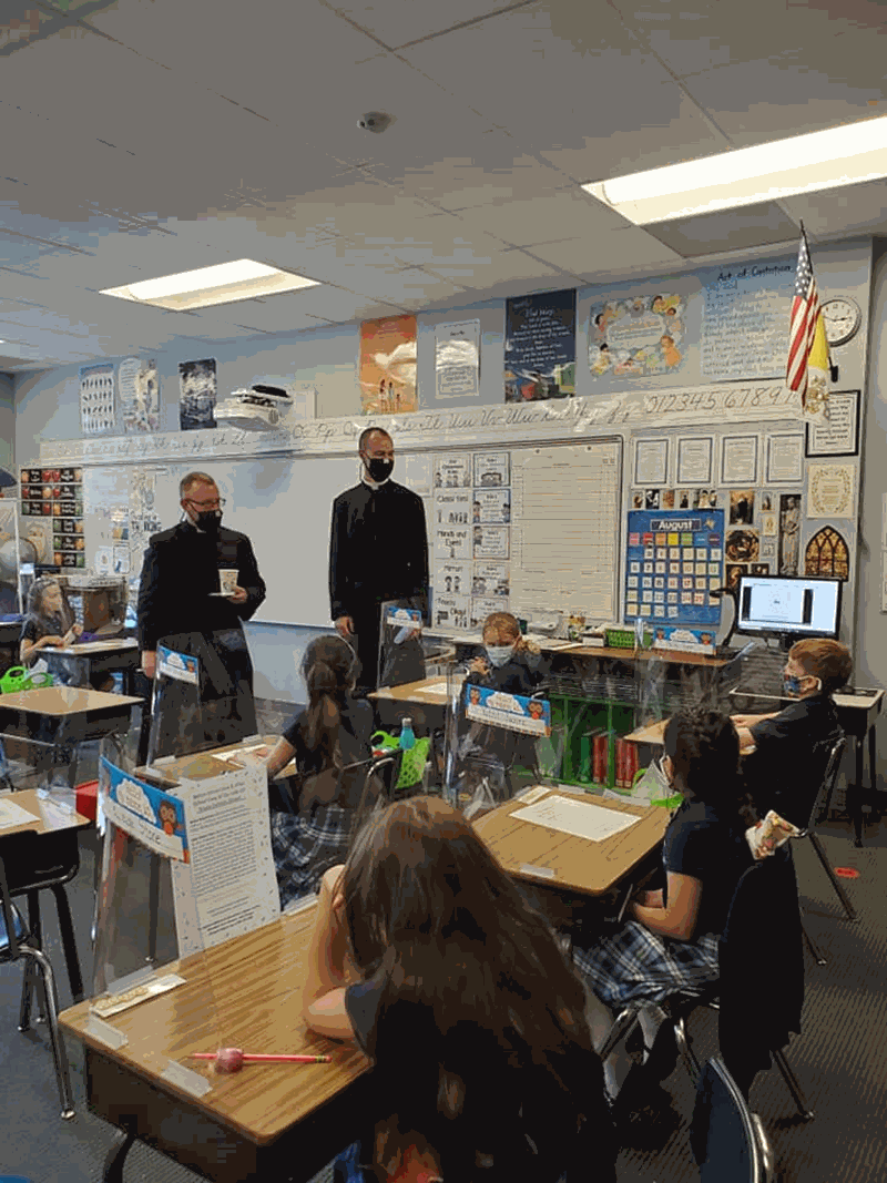 GREENSBORO — Our Lady of Grace students had very special visitors Aug. 31, Father Casey Coleman and Father Michael Carlson stopped by every classroom to say hi to the students and teachers and to give them a special blessing. (Photo via Facebook)