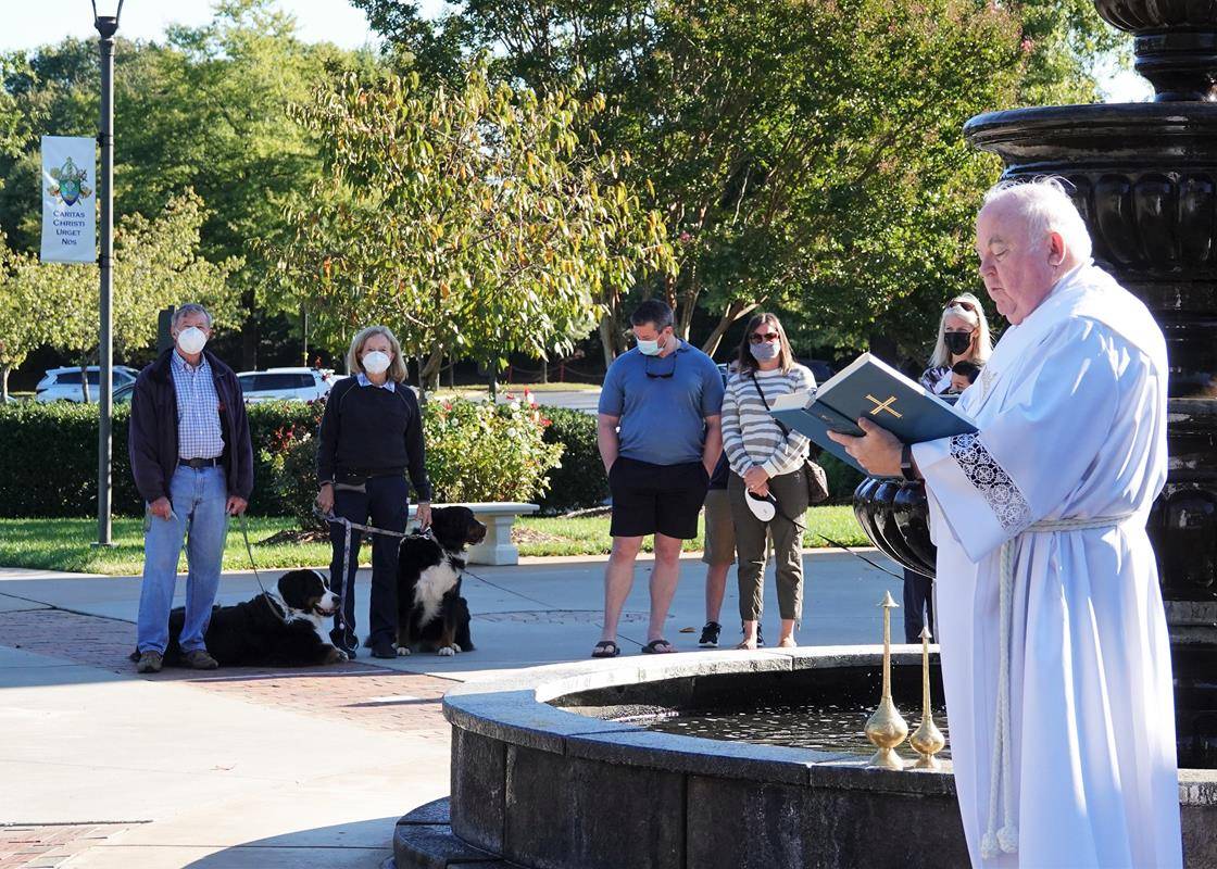 Reading from the Book of Blessings, Deacon Tom joyously and lovingly took the time to go from person to person, animal to animal to bless more than 25 pets including 4 cats, a bird, a rabbit, a gecko and even a turtle. (Photos provided by Amy Burger)
