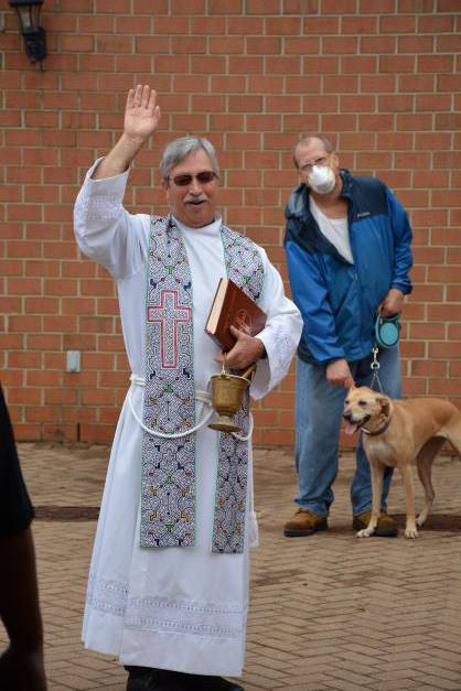 . There were many wagging tails as Father Mark Lawlor learned the names of each of the animals, and they received their blessing. (Provided by Lisa Cash)
