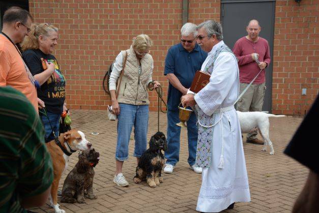 . There were many wagging tails as Father Mark Lawlor learned the names of each of the animals, and they received their blessing. (Provided by Lisa Cash)