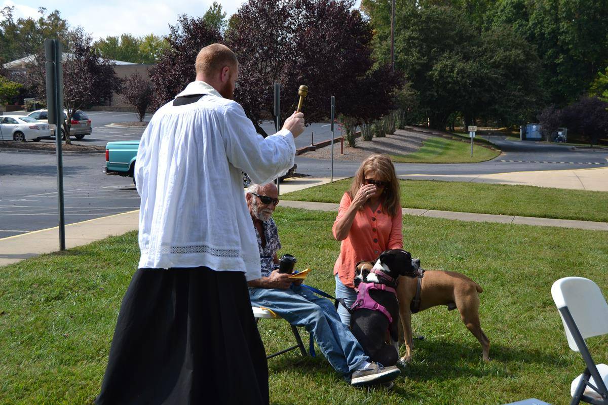 Parishioners brought pets outside Holy Cross Church in Kernersville to be blessed. (Photos by Paul Doizé)