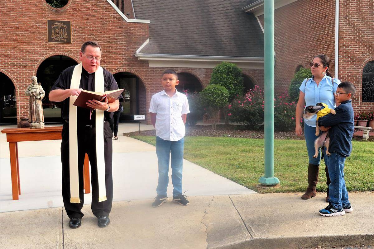 Father Thomas J. Kessler, pastor, blessed animals at St. Philip the Apostle Church in Statesville. (Photos provided by Connie Ries)