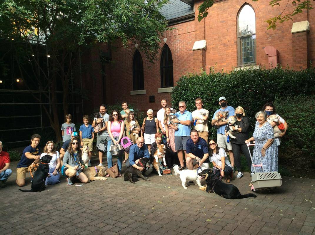 Deacon Jim Bozik held St. Peter Church in Charlotte’s annual Blessing of Animals prayer service. (Photo via Facebook)