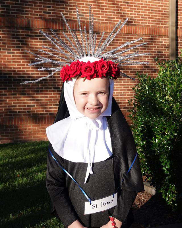 St. Mark Catholic School second graders had their annual All Saints Day Mass Oct. 27. (Photos by Amy Burger)