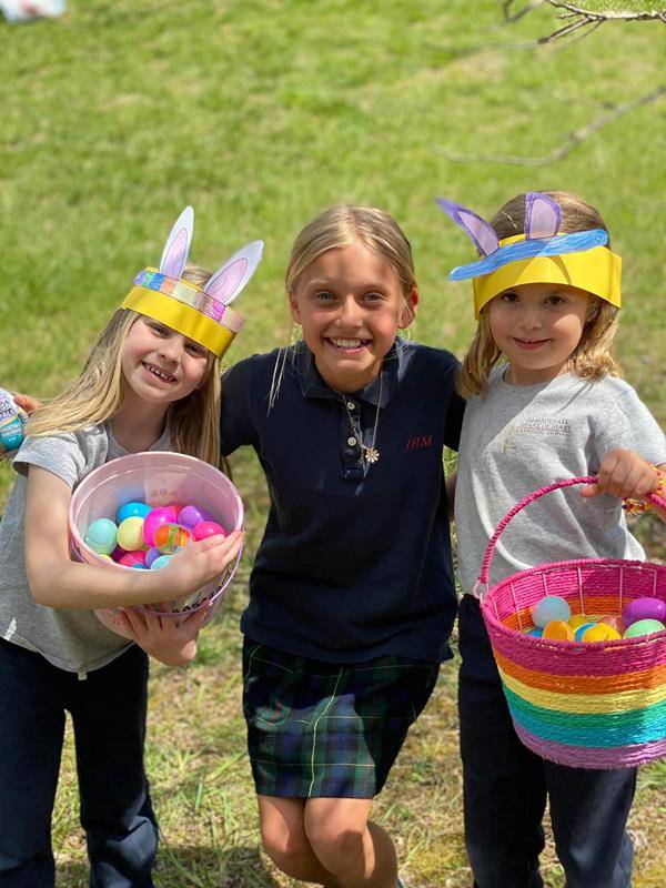 Fifth grade students helped their Kindergarten Prayer Partners with their Easter Egg hunt at Immaculate Heart of Mary School. (Photo via Facebook)