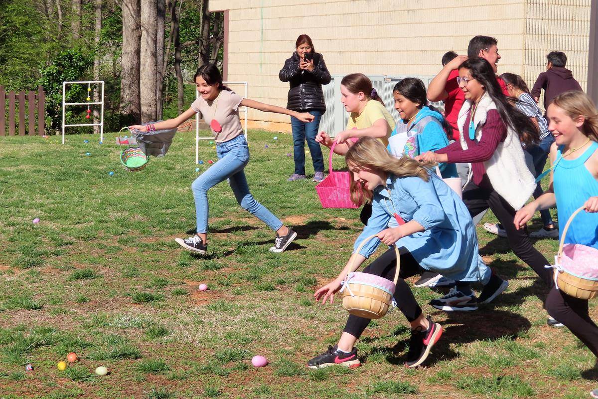 Games, face painting, and crafts preceded the Egg Hunt, followed by a hot dog dinner and an inflatable slide for the children to enjoy. (Photos by Connie Ries)