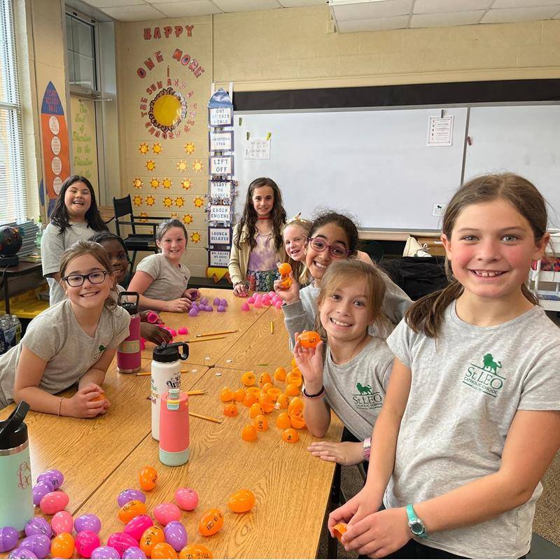 St Leo School third grade enjoyed an Easter Egg Hunt with their 8th Grade Prayer Partners. (Photo via Facebook)