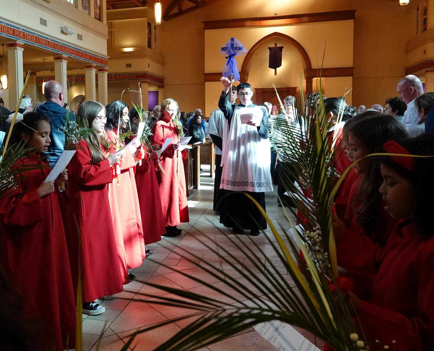 The Palm Sunday vigil Mass at St. Mark Church in Huntersville. (Amy Burger)