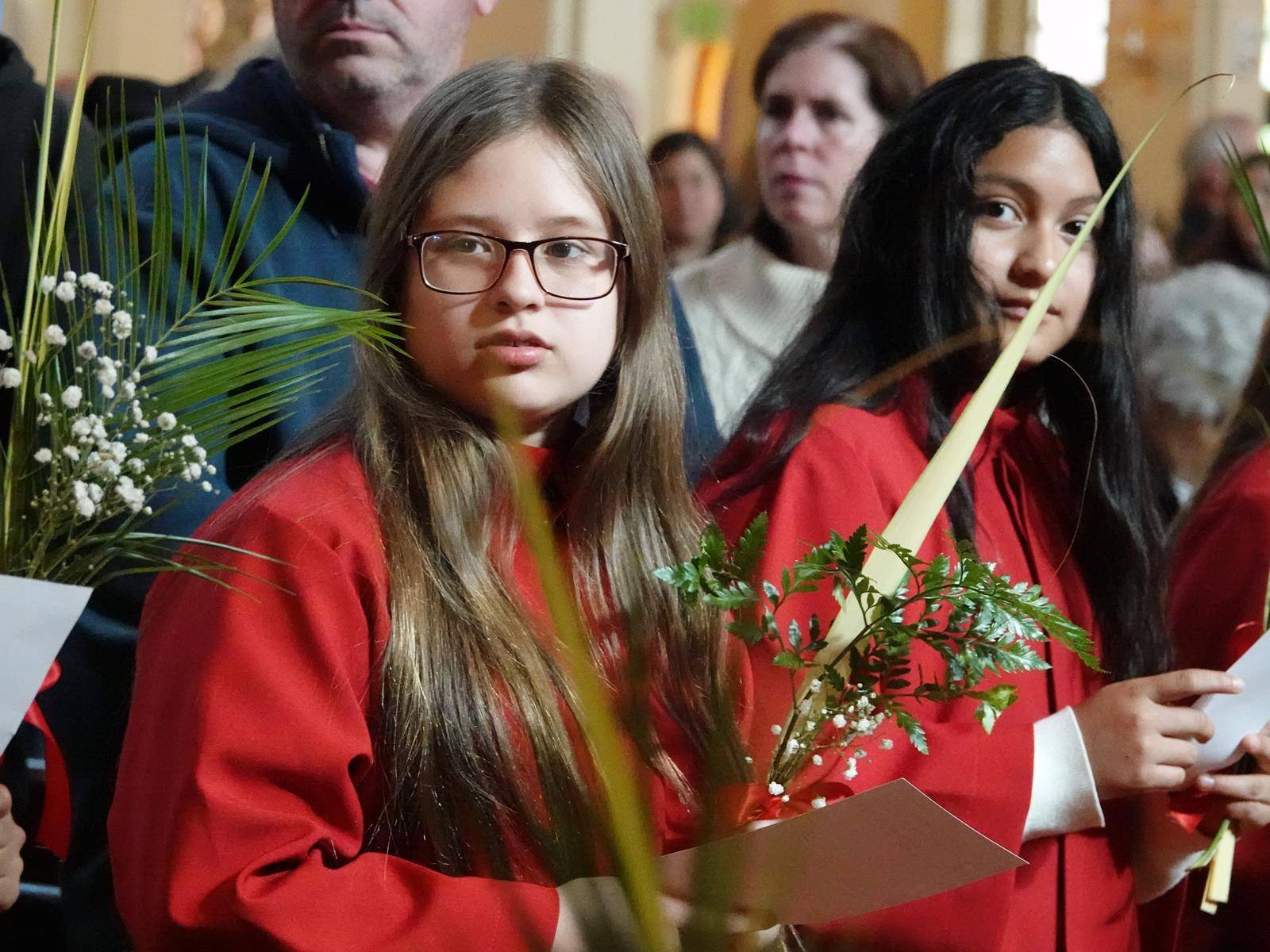 Children at St. Mark Church in Huntersville during the Vigil Mass. (Amy Burger)