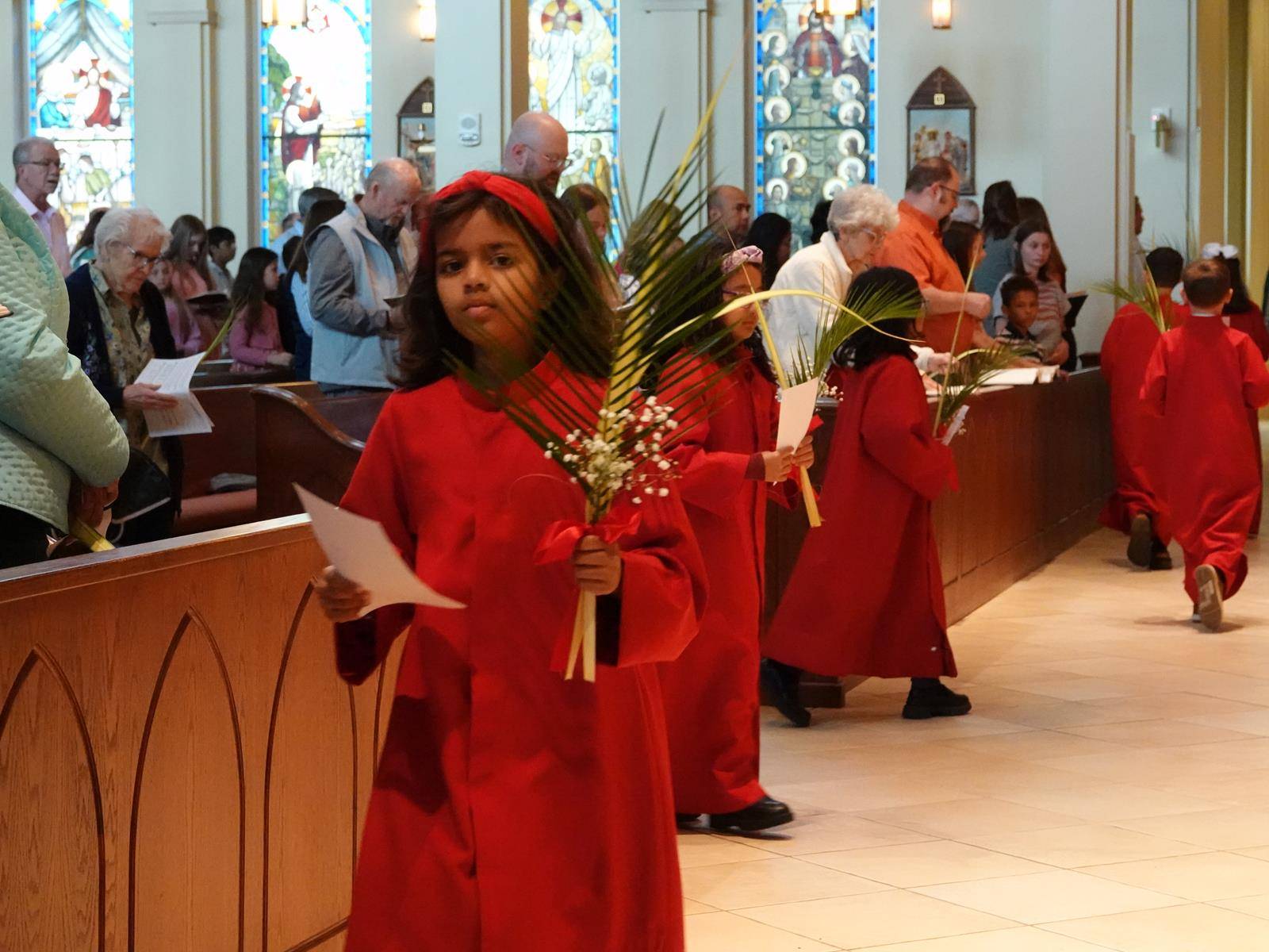 Children process into St. Mark Church in Huntersville during the Vigil Mass on April 12. (Amy Burger)