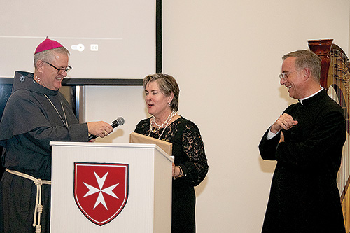 1222724 Bishop Mass Greensboro Holy Family dinner Dec 7. 1
